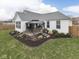 A lovely backyard includes a well-maintained lawn, mature landscaping, and a gazebo for outdoor enjoyment at 834 Bristle Lake Dr, Brownsburg, IN 46112