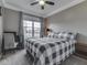 Bedroom with large window providing natural light and a dedicated desk area at 834 Bristle Lake Dr, Brownsburg, IN 46112