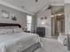 Comfortable bedroom with carpeting, vaulted ceiling, and decorative wall art at 834 Bristle Lake Dr, Brownsburg, IN 46112