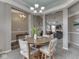 Cozy dining area offering views into the living room, and showcasing neutral wall paint and crown molding at 834 Bristle Lake Dr, Brownsburg, IN 46112