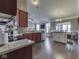 Open kitchen with granite countertops and stainless steel appliances, flowing into the living area at 834 Bristle Lake Dr, Brownsburg, IN 46112