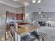 Spacious kitchen featuring an island with seating, stainless steel appliances, and a view into the Gathering room at 834 Bristle Lake Dr, Brownsburg, IN 46112