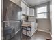 Functional laundry area with washer, dryer and white cabinetry at 834 Bristle Lake Dr, Brownsburg, IN 46112