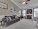 Living room features a fireplace, built-in shelving, neutral paint, and views of the adjacent dining area at 834 Bristle Lake Dr, Brownsburg, IN 46112