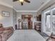 Open living room with seamless access to the kitchen, featuring neutral tones and stylish furnishings at 834 Bristle Lake Dr, Brownsburg, IN 46112