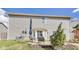 A patio area has outdoor furniture, a grill, and a yard with grass and a small tree at 8610 Fawn Way, McCordsville, IN 46055