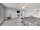 Spacious bedroom with a ceiling fan, television and adjacent bathroom at 8610 Fawn Way, McCordsville, IN 46055