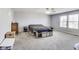 Neutral-toned bedroom with natural light, carpeting, and storage at 8610 Fawn Way, McCordsville, IN 46055