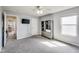 This bedroom has a modern ceiling fan, a television, a gray storage rack, and a window at 8610 Fawn Way, McCordsville, IN 46055