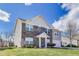 Charming two-story home featuring a brick facade, landscaped yard, and an attached garage at 8610 Fawn Way, McCordsville, IN 46055