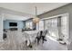 Open-concept living and dining area with light wood floors and ample natural light at 8610 Fawn Way, McCordsville, IN 46055