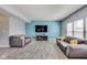 Spacious living room with two gray sofas and gray wood-look flooring at 8610 Fawn Way, McCordsville, IN 46055