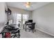 Home office with two desks, carpeting, and a ceiling fan at 8610 Fawn Way, McCordsville, IN 46055