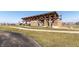Park pavilion with stone and timber construction, featuring a playground, walking path, and open green space at 8610 Fawn Way, McCordsville, IN 46055