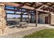 Covered picnic area with stone columns, offering comfortable seating for outdoor enjoyment and gatherings at 8610 Fawn Way, McCordsville, IN 46055