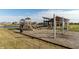 Community playground with slides, swings, and a covered picnic area, perfect for Gathering fun at 8610 Fawn Way, McCordsville, IN 46055