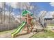 The playground has a swing, slide, climbing structure, and a small picnic table at 8610 Fawn Way, McCordsville, IN 46055