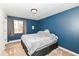Cozy bedroom features a comfortable bed and calming blue walls at 8829 Depot Dr, Indianapolis, IN 46217