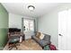 Bedroom with a futon, desk, and large window provides a bright, adaptable space at 8829 Depot Dr, Indianapolis, IN 46217
