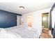 Relaxing bedroom featuring a closet and en suite half bath at 8829 Depot Dr, Indianapolis, IN 46217