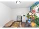 Sunlit bedroom features wood floors, colorful rug, and an eye-catching plant display at 8829 Depot Dr, Indianapolis, IN 46217