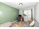 Cozy bedroom featuring a comfortable couch, desk setup, and ample natural light from the window at 8829 Depot Dr, Indianapolis, IN 46217