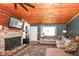 Open living area with a stone fireplace and comfortable sectional sofa, perfect for relaxing at 8829 Depot Dr, Indianapolis, IN 46217