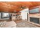 An open-concept living room offers seamless flow to a breakfast bar with views of the fireplace at 8829 Depot Dr, Indianapolis, IN 46217