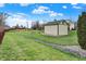 Picturesque backyard featuring a charming stream and an elegant storage shed, creating a serene outdoor space at 9255 W 30Th St, Indianapolis, IN 46234