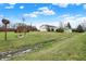 Expansive backyard with gazebo, stream, storage building and bird house offers endless outdoor possibilities at 9255 W 30Th St, Indianapolis, IN 46234