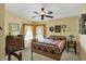 Inviting bedroom with large windows, ceiling fan, and decorative furnishings creating a cozy atmosphere at 9255 W 30Th St, Indianapolis, IN 46234