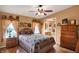 Cozy bedroom with hardwood floors, ceiling fan, and natural light at 9255 W 30Th St, Indianapolis, IN 46234