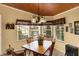 A spacious dining area has a charming window view and decorative touches at 9255 W 30Th St, Indianapolis, IN 46234