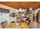 A view of the kitchen from the dining area highlights the wood ceiling at 9255 W 30Th St, Indianapolis, IN 46234