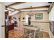 Charming dining room with hardwood floors, exposed wood beams and a decorative chandelier at 9255 W 30Th St, Indianapolis, IN 46234