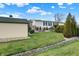 A cozy home exterior with well-manicured lawn, utility shed, and comfortable outdoor seating at 9255 W 30Th St, Indianapolis, IN 46234