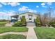 Inviting home with a charming front entrance, featuring a covered porch and lush greenery at 9255 W 30Th St, Indianapolis, IN 46234