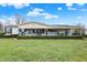 Charming single-story home boasts a well-manicured lawn and inviting front porch with rocking chairs at 9255 W 30Th St, Indianapolis, IN 46234