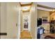 Hallway view towards a cozy bedroom with hardwood floors and ample natural light at 9255 W 30Th St, Indianapolis, IN 46234