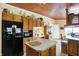 Well-equipped kitchen features wood cabinets, an island, and stainless steel appliances at 9255 W 30Th St, Indianapolis, IN 46234