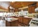 Spacious kitchen offers wood cabinets, an island, tile floors, and ample counter space at 9255 W 30Th St, Indianapolis, IN 46234