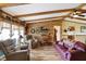 Bright living room with hardwood floors, exposed wood beams, lots of natural light and comfortable seating at 9255 W 30Th St, Indianapolis, IN 46234
