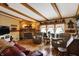 Cozy living room featuring a stone fireplace, hardwood floors, and comfortable seating at 9255 W 30Th St, Indianapolis, IN 46234