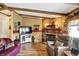 Inviting living space with stone fireplace, wood floors, and comfortable leather seating at 9255 W 30Th St, Indianapolis, IN 46234