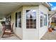 Cozy porch corner featuring rocking chairs and warm, natural light, perfect for relaxation at 9255 W 30Th St, Indianapolis, IN 46234