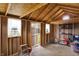 Bright, unfinished interior of a storage shed with exposed wood framing, featuring a storage rack and natural light at 9255 W 30Th St, Indianapolis, IN 46234