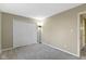 Neutral carpeted bedroom featuring a spacious closet and a neutral color scheme at 9464 Fordham St, Indianapolis, IN 46268
