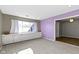 Bright bonus room with built-in shelving, carpet, and large window at 9464 Fordham St, Indianapolis, IN 46268