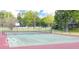 Community tennis court with a net and surrounding greenery for recreational enjoyment at 9464 Fordham St, Indianapolis, IN 46268
