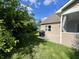 Patio with BBQ pit with tree, blue sky, and green grass at 9752 Brook Wood Dr, McCordsville, IN 46055